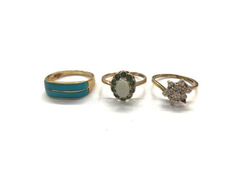 Egyptian gold turquoise panel ring and two 9ct gold gem set cluter rings (3)Egyptian gold ring weighs 2.7 gramsTwo 9ct gold r