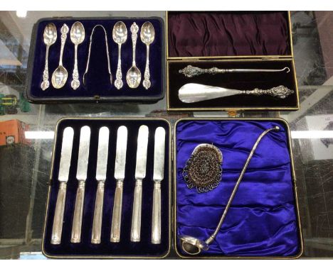 Set of six silver teaspoons and sugar tongs, cased silver handled button hook and shoe horn, cased set of silver handled kniv