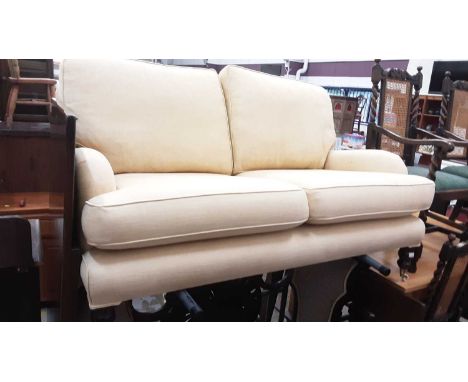 Good quality two seater sofa with cream/yellow upholstery on turned front legs with ceramic castors, 154cm wideSeats clean wi