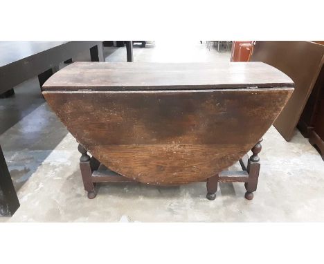 Antique oak oval drop leaf table with end drawer on bobbin turned and block legs, opening to 124cm x 162cm