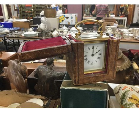 Brass carriage clock in leather travelling case.