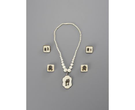 A MIXED LOT OF FIVE IVORY ITEMSJapan, Meiji period (1868-1912)Consisting of two ivory buttons, two pins, and a necklace with 