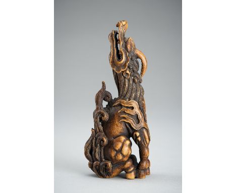 KOMEI: A WOOD NETSUKE OF A KIRINSigned Komei 光明Japan, 20th centuryCarved as a Kirin standing foursquare with its feet close t