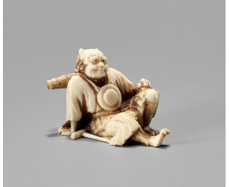 YOSHIAKI: AN IVORY OKIMONO NETSUKE OF AN ONI NEMBUTSU, MEIJISigned Yoshiaki  Japan, early Meiji period (1868-1912) Finely car