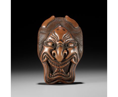 A POWERFUL AND RARE WOOD TONKOTSU IN THE FORM OF A HANNYA MASKUnsigned Japan, 19th centuryWell carved as a Hannya mask for th