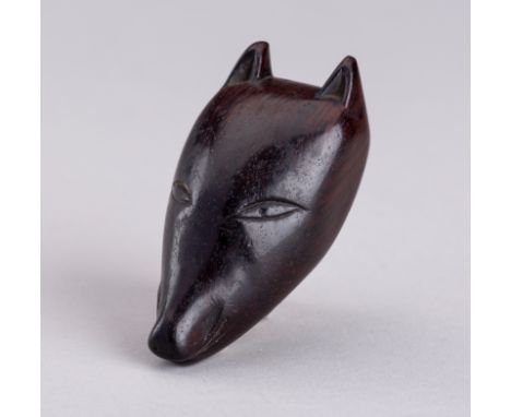 AN UNUSUAL WOOD FOX MASK NETSUKE, 19TH CENTURYJapan, 19th century Well carved as a kitsune (fox) mask with pricked pointy ear
