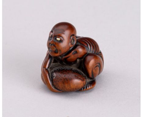 GYOKKEI: A WOOD NETSUKE OF A BLIND STONE LIFTER, MEIJIBy Gyokkei, signed Gyokkei 玉珪Japan, Tokyo, Meiji period (1868-1912)Depi