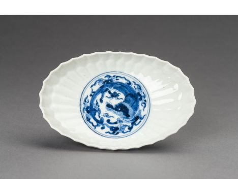A BLUE AND WHITE 'DRAGON' ARITA PORCELAIN TRAY, MEIJIJapan, Meiji period (1868-1912). Of ovoid form, the interior with a hone
