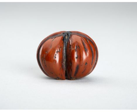 A NETSUKE OF A DOUBLE WALNUT, 19th CENTURYJapan, 19th century The netsuke consisting of conjoined nuts, the walnut shell fine