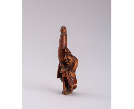 A WOOD NETSUKE OF A SLEEPING TEMPLE SERVANT, EDO PERIODJapan, 19th century, Edo period (1615-1868) Carved as a temple servant