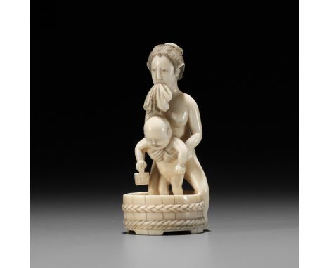 A FINE IVORY OKIMONO OF A MOTHER BATHING HER CHILDUnsignedJapan, Tokyo, Meiji period (1868-1912)Finely carved as mother stepp