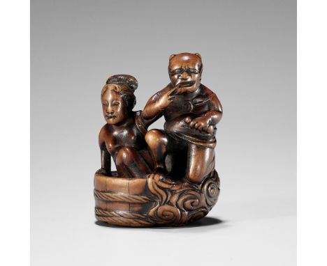 HOMIN: A GOOD WOOD NETSUKE OF RAIJIN WITH BATHING WOMANBy Homin, signed Homin 法眠Japan, early 19th century, Edo period (1615-1