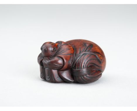 A WOOD NETSUKE OF A SLEEPING KARAKO, EDO PERIODJapan, 19th century, Edo period (1615-1868) Well carved, depicting a karako sl