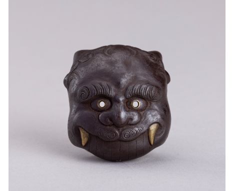 HARUAKI (SHUNMEI): A RARE IRON MASK NETSUKE OF AN ONI, 19TH CENTURYBy Haruaki (Shunmei), signed Haruaki (Shunmei) Japan, 19th