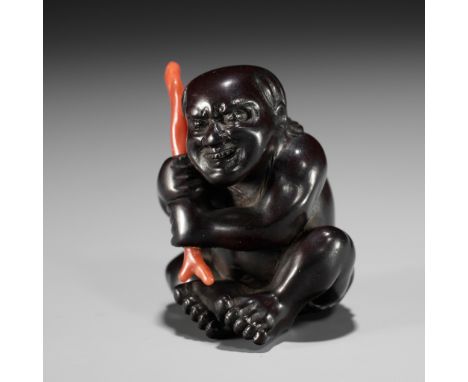 TOMOKAZU: A DARK WOOD NETSUKE OF A CORAL FISHERMANSigned Tomokazu 友一Japan, Edo (Tokyo), mid-19th century, Edo period (1615-18