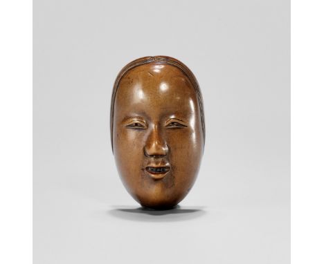 A SIGNED BOXWOOD NOH MASK NETSUKE OF SHAKUMI, EDO PERIODJapan, 19th century, Edo period (1615-1868)Well carved as the Noh Mas