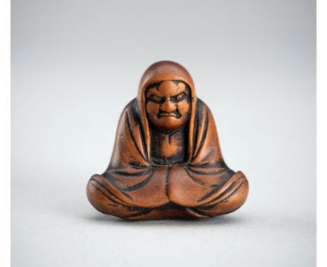 A BOXWOOD NETSUKE OF DARUMA, EDO PERIODJapan, 19th century, Edo period (1615-1868)Carved as the Zen patriarch Daruma, sitting