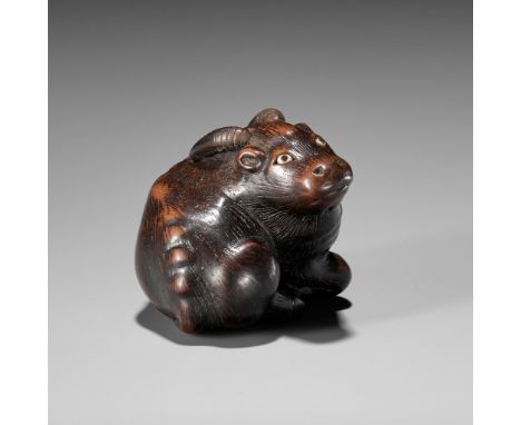 MASAKAZU: A FINE WOOD NETSUKE OF A RECUMBENT GOATBy Masakazu, signed Masakazu 正一Japan, 19th century, Edo period (1615-1868)Fi