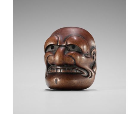 TADATOSHI: A FINE NAGOYA SCHOOL WOOD MASK NETSUKE OF BUAKUBy Tadatoshi, signed Tadatoshi 忠利Japan, Nagoya, first half of 19th 