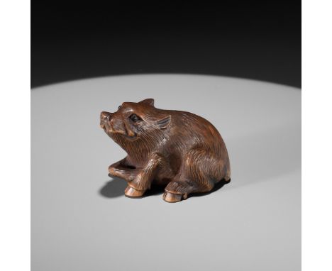 A WOOD NETSUKE OF A RECUMBENT BOAR, INSCRIBED MASANAOInscribed Masanao 正直Japan, 20th centuryFinely carved as a recumbent boar