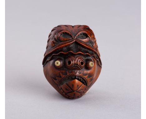MITSUAKI: A RARE WOOD NETSUKE OF A BAKEMONO MASK, MEIJIBy Mitsuaki, signed Mitsuaki  Japan, Meiji period (1868-1912)Carved wi