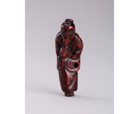 A LACQUERED WOOD NETSUKE OF A SAGE, EDO PERIODJapan, early 19th century, Edo period (1615-1868)The wood netsuke lacquered in 