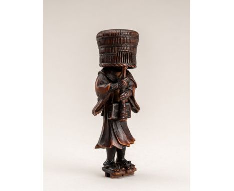 A WOOD NETSUKE OF A KOMUSO MONK, MEIJI PERIODJapan, Meiji period (1868-1912)Finely carved, depicting a komuso monk (mendicant