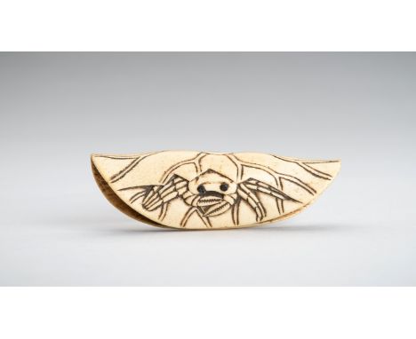A STAG ANTLER NETSUKE OF A CRAB ON A LOTUS LEAFJapan, 19th centuryThe netsuke carved as a folded lotus leaf with incised vein