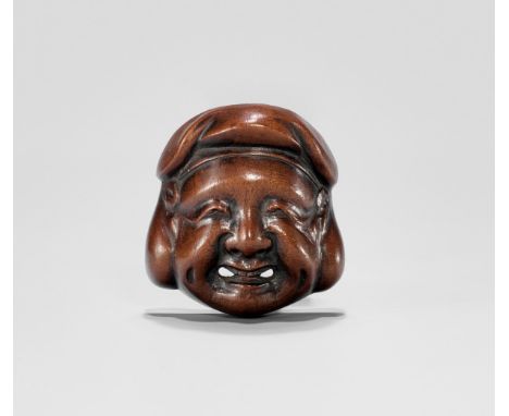 A WOOD MASK NETSUKE OF DAIKOKU, EDO PERIODJapan, 19th century, Edo period (1615-1868)Carved as he lucky god of wealth, Daikok