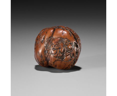 HIDARI ISSAN: A KURUMI (WALNUT) NETSUKE DEPICTING AN OX HERDERBy Hidari Issan, signed Hidari Issan 左一山 with sealJapan, Iwashi
