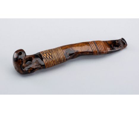 A RARE UMIMATSU OBI-HASAMI NETSUKE WITH RATTAN, EDO PERIODJapan, 19th century, Edo period (1615-1868)Carved from umimatsu (se