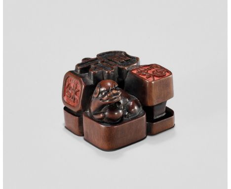 A WOOD NETSUKE WITH A GROUP OF SEALS, EDOJapan, 19th century, Edo period (1615-1868)Carved in openwork as a group of nine sea