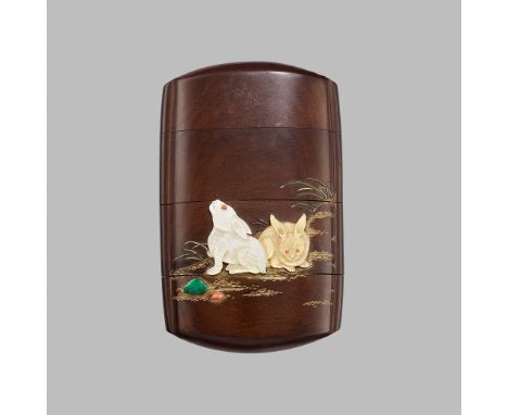AN EXQUISITE INLAID WOOD THREE-CASE INRO DEPICTING RABBITSUnsigned Japan, late 19th century, Meiji period (1868-1912)The wood