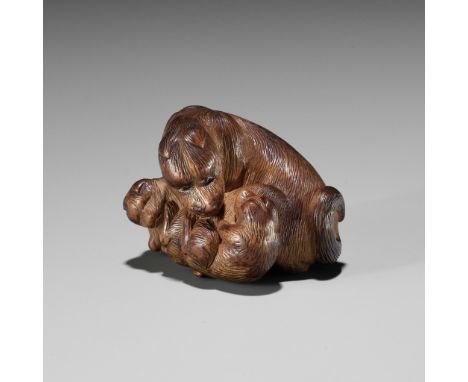 SHIGEHIRO: A CHARMING WOOD NETSUKE OF A DOG AND TWO PUPSBy Shigehiro, signed Shigehiro 重寛Japan, 19th century, Edo period (161