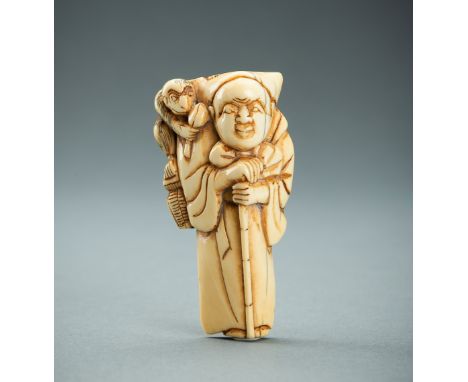 AN IVORY NETSUKE OF A SARUMAWASHI WITH MONKEY, EDO PERIODJapan, late 18th to early 19th century, Edo period (1615-1868) Of tr