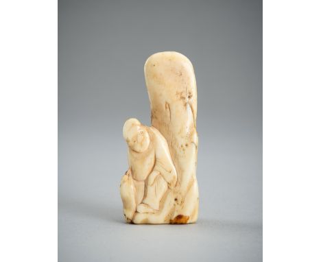 AN IVORY NETSUKE OF A MAN RESTING ON A ROCK, EDO PERIODJapan, early to mid-18th century, Edo period (1615-1868) The man is de