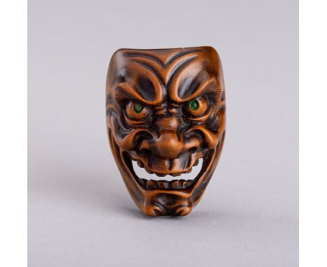 A SANSHO STYLE WOOD MASK NETSUKE OF A DEMON, MEIJIJapan, late 19th to early 20th century, Meiji period (1868-1912)Carved as a