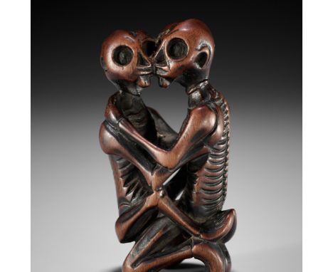 GYOKUSEN: A SUPERB WOOD NETSUKE OF TWO AMOROUS SKELETONS  By Gyokusen, signed Gyokusen 玉仙 Japan, 18th to early 19th century, 