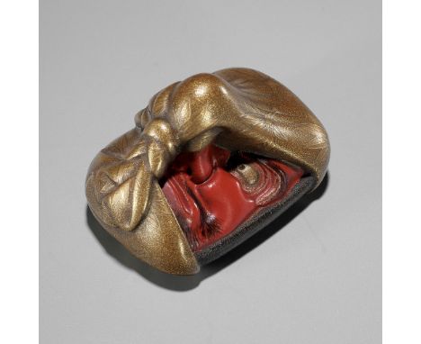 AN EXCEPTIONAL LACQUER NETSUKE OF A KONOHA TENGU MASK WRAPPED IN A FUROSHIKIUnsigned Japan, 19th centuryFinely modeled as a l