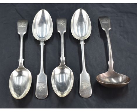 A group of four late Victorian fiddle pattern dessert spoons, engraved with Demi lion crest and with pip reverse, marks for S