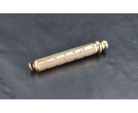 A Sampson &amp; Mordan &amp; Co gilt metal propelling pencil with engine-turned body and push/pull action, marked S. Mordan &
