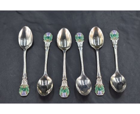 A cased set of six early Queen Elizabeth II silver and enamel Scottish design coffee spoons, each terminal moulded and enamel