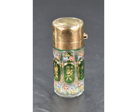 A George V silver gilt and Bohemian glass scent bottle, of cylindrical form, the hinged cover moudled with reed and ribbon ed