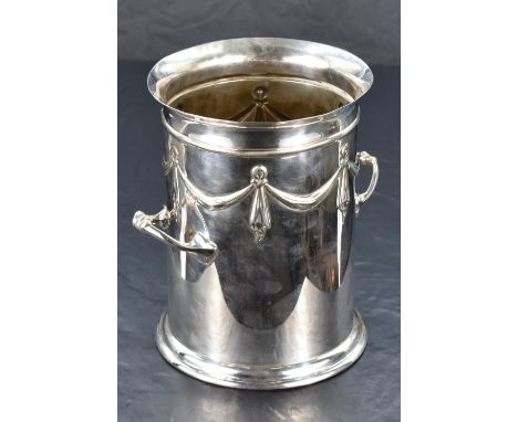 An early 20th century silver-plated bottle holder, of cylindrical form with twin handles, shallow flared rim, decorated with 