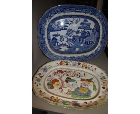 Two antique ceramic charger plates including Masons and a traditional willow ware platter