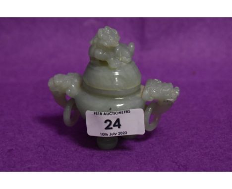 A Chinese or similar Jade stone hand carved three footed Koro having dog of Fo lid and twin dragon head handles