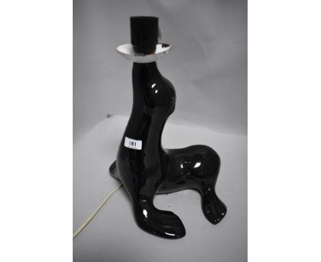 A vintage seal shaped lamp base. 29cm to fitting, some enamel losses to 'drip pan' otherwise good condition.