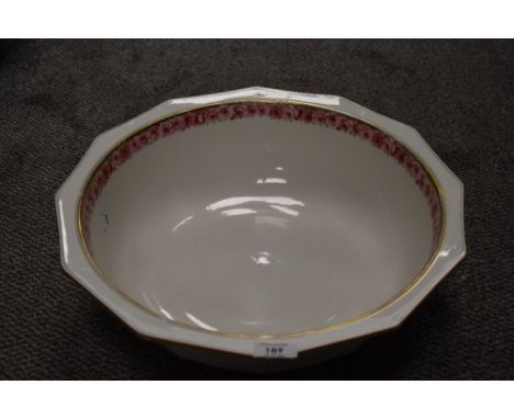 An early 20th century wash basin having rose transfer pattern and gilt detailing. some wear to gilded decoration.