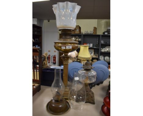 A Victorian oil lamp having Greek style column base with Vaseline glass light shade