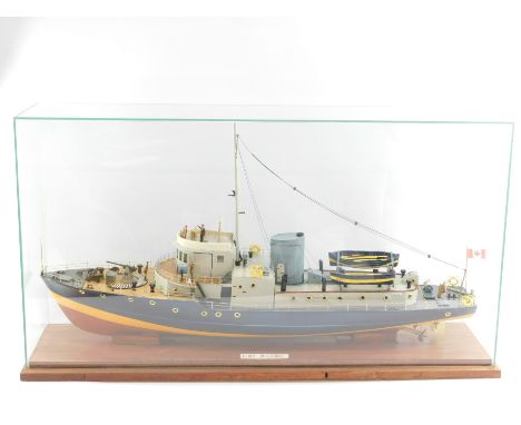 A scale model of a Royal Canadian Mounted Police Boat 'McDonald', with figures, cased, 47cm high, 91cm wide.